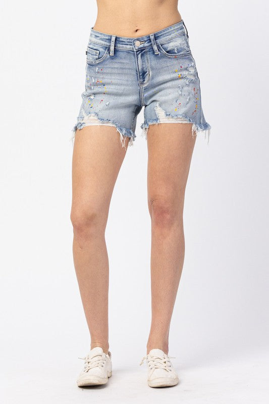 Rainbow Paint Splash Cutoff Shorts. Judy Blue Mid-rise.
