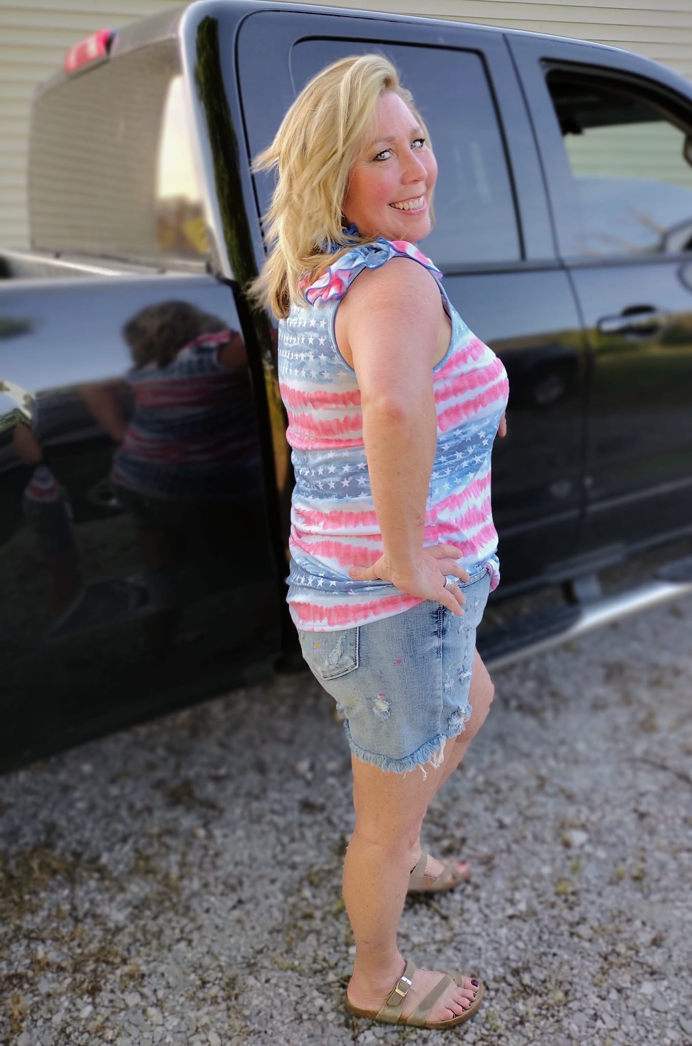 SO CUTE! I am a true American Loving Large/X-Large wearing X-Large in this cool Patriotic Poly rayon jersey stars and stripe tank top featuring ruffle shoulder details 65% POLYESTER 30% RAYON 5% SPANDEX Tank! A cool addition to your wardrobe for the 4th!